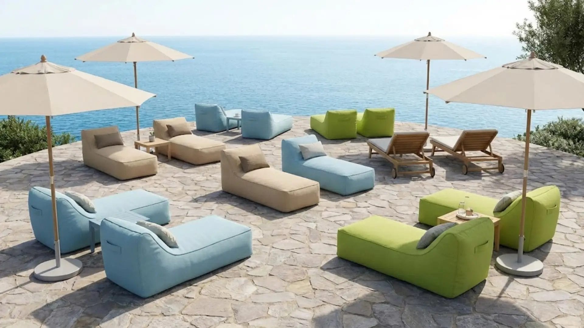 Wide-angle view of a luxury resort terrace furnished with a complete DERBAL outdoor furniture solution, including various bean bag loungers, side tables, and umbrellas.