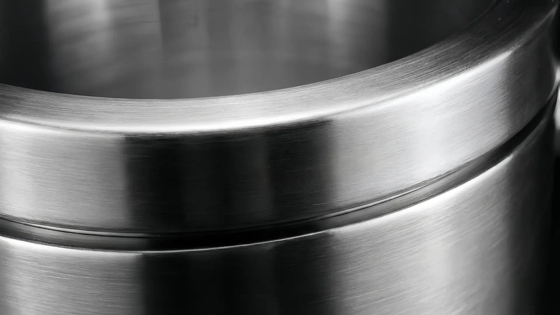Macro shot highlighting the thick rim and brushed texture of a DERBAL 304 stainless steel double-wall hotel ice bucket.
