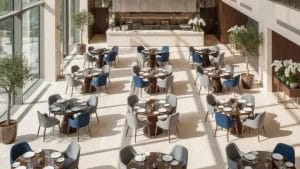 Luxury hotel furniture arrangement in a restaurant with optimized aisle spacing for service flow.