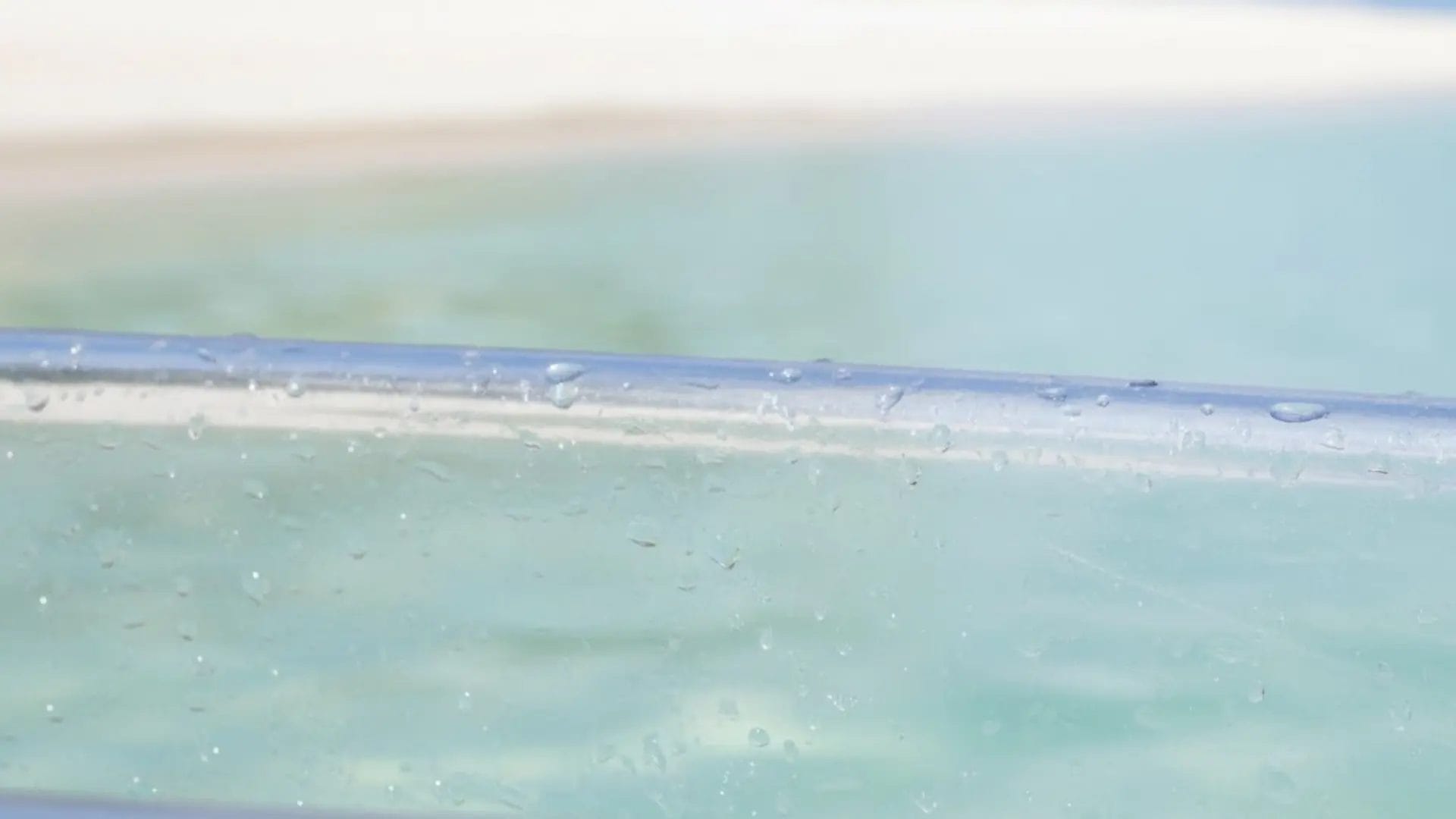 Durable marine-grade polycarbonate hull of a professional transparent kayak.