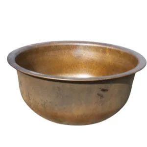 Side view of a hand-hammered solid brass foot basin showcasing the fire-forged texture and heavy-duty rim.