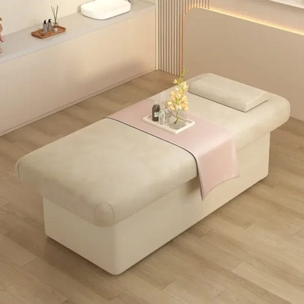 Single beige light luxury spa massage bed with a flat top and velvet upholstery