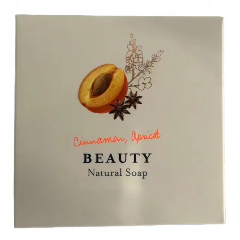 A macro close-up of the BEAUTY Hotel Organic Natural Soap, revealing the rich botanical oils and gentle monocrystalline sugar exfoliants.