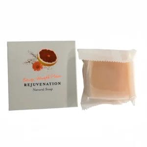 A macro close-up of the REJUVENATION Hotel Organic Natural Soap highlighting the soothing marigold extracts and rich shea butter texture.