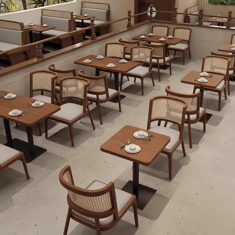 A bright, bustling resort all-day dining and breakfast buffet area featuring dozens of perfectly aligned Oak Dining Chairs.