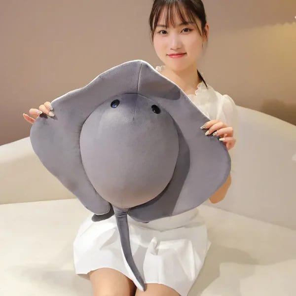 A macro close-up of the smooth, four-way stretch velvet fabric used on the plush manta ray.