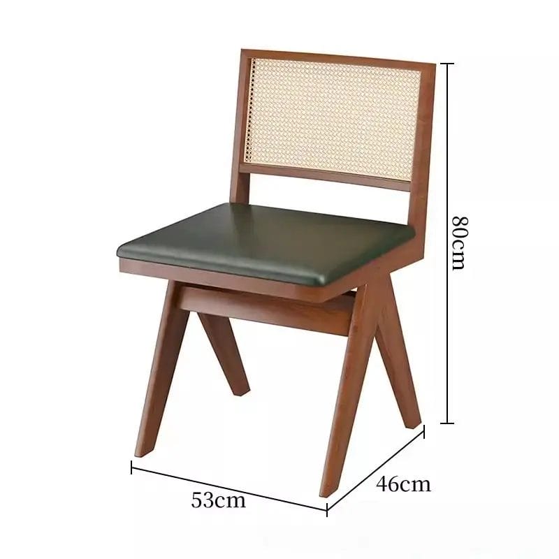 A beautifully set fine dining restaurant table surrounded by four elegantly upholstered Oak Dining Chairs under ambient lighting.