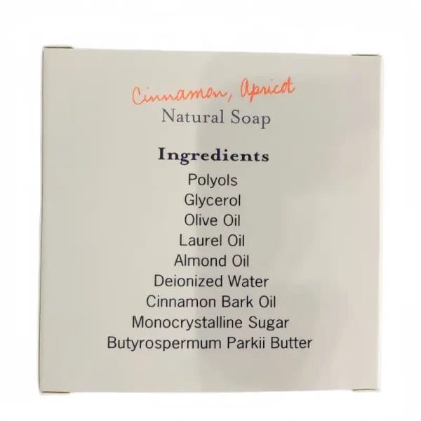 A beautifully wrapped BEAUTY Hotel Organic Natural Soap infused with cinnamon and apricot, resting on a luxury resort marble vanity.