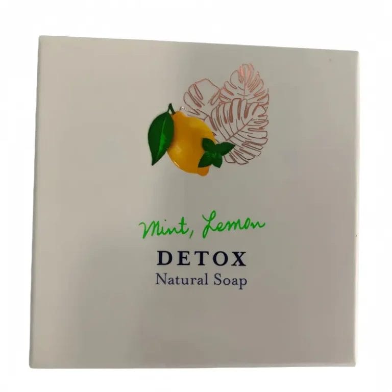 A beautifully packaged Mint and Hotel Soaps Lemon DETOX Natural Soap displayed elegantly on a luxury resort marble vanity.