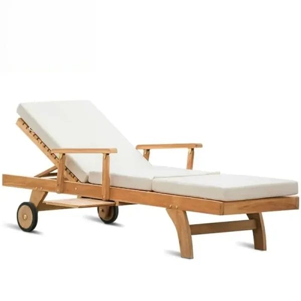 A pool attendant effortlessly rolling the heavy Teak Sun Bed using the discretely concealed rear nylon wheels.