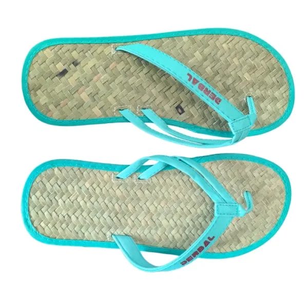 Natural Raffia Straw Flip Flops placed neatly on a bamboo mat inside a serene, high-end hotel wellness spa.