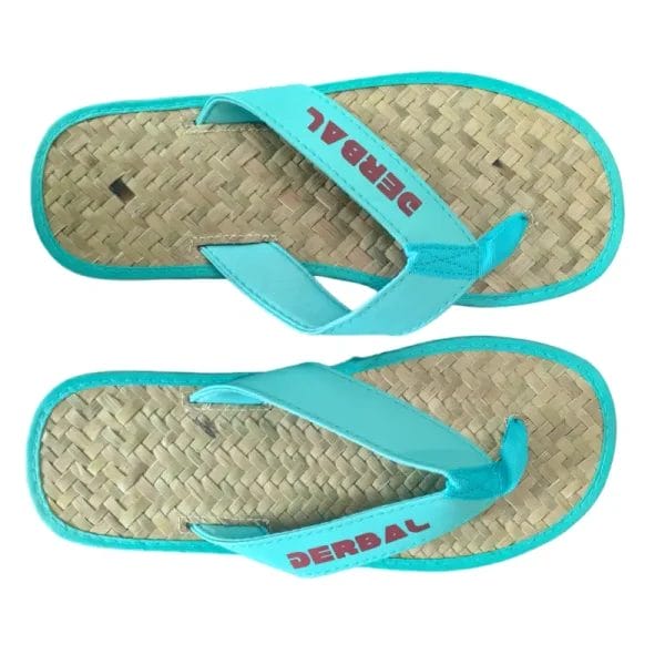 A close-up view focusing on the soft, padded, and moisture-wicking fabric strap of the Raffia Straw Flip Flops.