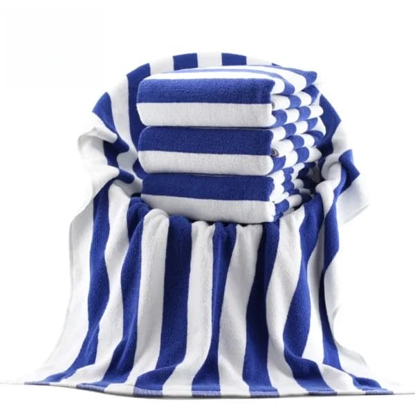 Luxury 600GSM blue and white striped cotton Beach Towel for resort pool decks.