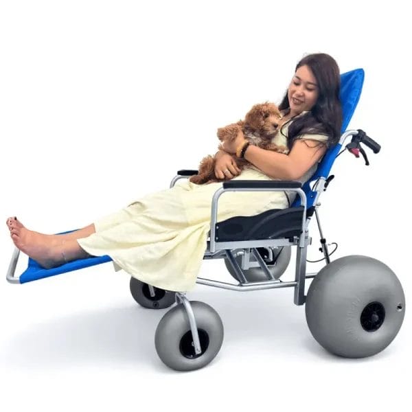 An Island Beach Sand Wheelchair being used on a white sand beach at a luxury Maldives resort.