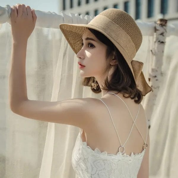 Close-up of premium natural raffia weave on a Beach Sun Straw Hat.